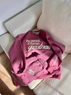 The Pursuit of Human Greatness Sweatshirt - Sugar Plum – The Happy Camp3r Pink School Spirit Sweatshirt, Sweatshirt Merch Ideas, Relaxed Fit Athleisure Tracksuit With Letter Print, Relaxed Fit Tracksuit With Letter Print For Loungewear, Fleece Sweats With Letter Print In Athleisure Style, Athleisure Sweats With Letter Print, Relaxed Fit Fleece Tracksuit In Athleisure Style, Relaxed Fit Fleece Tracksuit For Athleisure, Relaxed Fit Fleece Tracksuit Athleisure