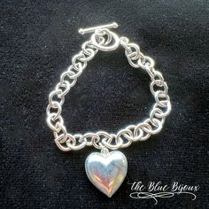 7 1/4 inches long, silver toned heart charm is about .5 inches x . 5 inches. Clasp is a toggle style. This adorable bracelet would make a great gift for a friend. Silver Heart Bracelet With Toggle Clasp, Silver Heart-shaped Bracelet With Toggle Clasp, Heart Charm Bracelet With Toggle Clasp For Gift, Heart-shaped Charm Bracelet With Toggle Clasp As Gift, Metal Heart Bracelet With Toggle Clasp As Gift, Heart Shaped Bracelet With Toggle Clasp As Gift, Heart Shaped Toggle Clasp Bracelet For Gift, Metal Heart Bracelet With Toggle Clasp, Bracelet Heart