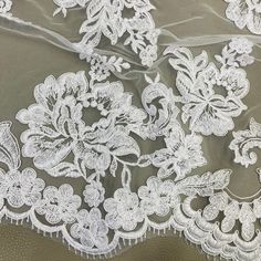 Handmade, high quality Double Sided Floral Lace Trimming Corded Embroidered on 100% Polyester Net Mesh. Beautiful on wedding dresses, evening gowns, dance costumes, and more. Content: 100% Polyester / Minimum Order: 1 Yard / Size: Approximately 17.5" Wide / Ships within 24 business hours. Colors: This product comes in 4 different colors.