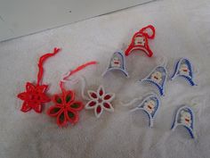 four crocheted bells are laying on a towel