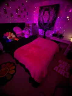 a bed with pink lights in a bedroom next to a painting on the wall and floor