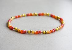 Yellow, Orange, Pink & Gold Summer Bracelet Mixed Beads I can make the bracelet to your size. Just send me a message or you will receive a standard size (18cm) bracelet. Orange Stackable Beaded Bracelets As Gift, Orange Stackable Beaded Bracelets For Gifts, Flexible Friendship Bracelets With Round Beads As Gift, Flexible Stretch Bracelet With Tiny Beads As Gift, Flexible Stretch Bracelet With Tiny Beads For Gift, Yellow Stretch Bracelet With Tiny Beads As Gift, Small Gifts For Women, Pink Gold Bracelet, Beige Bracelet