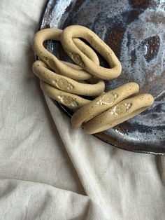 a plate that has some kind of thing in it on top of a table cloth