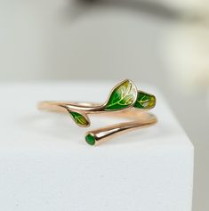 Minimalist rings for women can be a perfect gift for a birthday or a great gift for Christmas. Also, it can be a wonderful gift for grandma who likes nature. Our rings is handmade jewellery and we have three band colour options: silver, rose, and gold with three different colours of leaves. Inspired by nature, we are proud to offer this unique design emerald green olive tree branch rings.   📏 Adjustable size rings for women. No size problem!  It is made of 925 sterling silver and handmade Jewel Nature-inspired Ring With May Birthstone For Gift, Silver Crown Ring, Branch Ring, Leaf Ring, Fall Jewelry, Christmas Gifts For Women, Pink Ring, Minimalist Rings, Christmas Gifts For Her