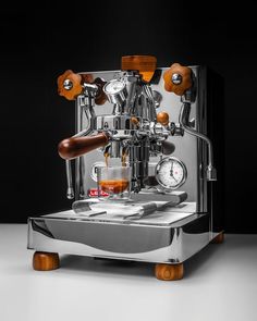 an espresso machine sitting on top of a table