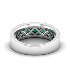 This exquisite emerald and diamond wedding band is a stunning symbol of eternal love and commitment. Crafted with precision and care, the band features alternating emerald and diamond stones set in a delicate and elegant design. The vibrant green emeralds are complemented by the sparkling diamonds, creating a beautiful contrast that will surely captivate anyone's attention. Metal: 14K Gold Setting Type: Prong Rhodium Finish: Yes, on White Gold Gemstone Details: Gemstone: Emerald Shape: Round Ave Emerald Rings With Pave Setting For Anniversary, Anniversary Emerald Rings With Pave Setting, Emerald Pave Setting Ring For Anniversary, Emerald Ring With Pave Setting For May Birthstone Anniversary, Emerald Anniversary Ring With Pave Setting, Elegant Half Eternity Emerald Ring For Anniversary, Emerald Ring With Diamond Channel Set For Anniversary, Channel Set Diamond Emerald Ring For Anniversary, Classic Emerald Ring With Pave Setting For Promise