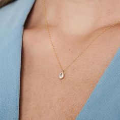 The Delicate CZ Drop Necklace features a high-quality cubic zirconia pendant in a teardrop format on a delicate 14K gold-filled chain. This tiny diamond pendant necklace is perfect for a bridesmaid necklace gift or for that special occasion. PRODUCT DETAILS: The stone is 6mm. Zirconia Stone in a 14k goldfilled setting MATERIALS: 14K Gold Filled 14K Gold Filled jewelry is not the same as gold-plated jewelry. It contains 5% of solid gold and is done by a process of heat bonding. The layer of gold Dainty Cubic Zirconia Drop Necklace, Delicate Solitaire Teardrop Pendant Necklace As Gift, Delicate Teardrop Pendant Solitaire Necklace For Gift, Delicate Teardrop Solitaire Necklace As Gift, Delicate Teardrop Solitaire Necklace For Gift, Dainty Teardrop Charm Necklace For Wedding, Teardrop Charm Necklace For Wedding With Delicate Chain, Wedding Teardrop Charm Necklace With Delicate Chain, Dainty Teardrop Pendant Solitaire Necklace As Gift