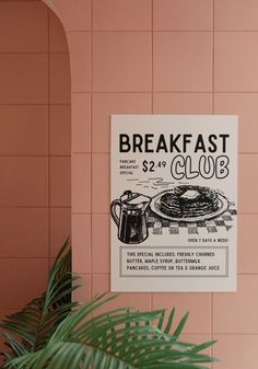 a sign on the wall that says breakfast club