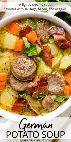 german potato soup with sausage, carrots and veggies in a white bowl