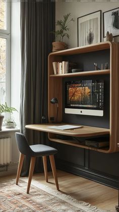 a wooden desk with a computer monitor on top of it next to a chair in front of a window