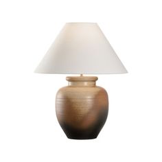 a table lamp with a white shade on it's base and a brown vase