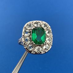 * Clyde Duneier CID Sterling Silver Green Tourmaline White Amethyst Cocktail Ring * Ring Size: 10 * Top of ring measures: 1" x 7/8" * Height: 1/2" * Emerald Cut Green Tourmaline total carat weight: approximately 3.5 tcw * Round White Amethyst total carat weight: approximately 3.0 tcw * Weight: 7.2 tgw * Condition: Great * S3297    Exported By ExportYourStore :) Oval Tsavorite Multi-stone Ring, Oval Multi-stone Tsavorite Rings, Collectible May Birthstone Gemstone Rings, Collectible Gemstone Rings For May Birthstone, Victorian Emerald Gemstone Ring, Amethyst Cocktail Ring, Ring Size 10, Green Tourmaline, Cocktail Ring