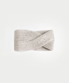 the knotted headband is made from wool and features a white knitted fabric,