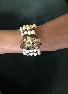 "This VINTAGE DEMARIO  BRACELET from the 1950s would be a stunning  accessory for your spring wardrobe.The 5 beaded strands end in a floral clasp with rhinestone touches .THe famous costume jeweler's stamp is visible on the clasp.Truly a wonderful  mother's day gift or indulgence for yourself it remains a collectible to treasure.7\" in length. ** Contact Vendor for international shipping price." White Beaded Bracelet, Unique Hats, Bridesmaid Accessories, Spring Wardrobe, Hat Pins, The 1950s, Bridesmaids Gifts, Gift Accessories, Vintage Signs