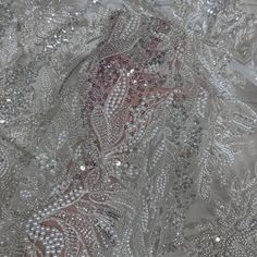 This high quality Fabric is measured in 5 Yards With Embroidered Beading and Sequin. It is soft, very delicate and beautiful. This high Quality Fabric is made with Fashion embroidered rhinestones can be used in making party wedding dresses, skirts, shawls, scarves and other other fashion apparels as you would like. Size : Length : 5 yards (180 inch). Width: 50 inch (Please allow slight deviation for the measurement data ,±1 inch) Material: 100% Polyester, Tulle Lace Fabric, Eco-Friendly embroide Embellished Organza Wedding Dress For Ceremony, Elegant Embroidered Organza Wedding Dress, Elegant Embellished Embroidered Fabric For Mother Of The Bride, Elegant Embellished Fabric For Mother Of The Bride, Glamorous Organza Sequin Fabric For Wedding, Elegant Silver Embroidered Organza Fabric, Glamorous Wedding Sequin Organza Fabric, Elegant Embroidered Fabric With Rhinestones For Wedding, Elegant Silver Embellished Embroidered Fabric