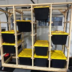 the storage area is filled with plastic containers and shelves that hold several different types of bins