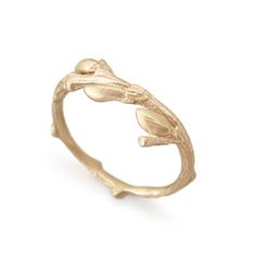 a gold ring with leaves on it