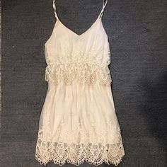 This Dress Is Gorgeous On So Many Levels! Perfect For Summer, Never Worn Beige Lace Patchwork Dresses For Summer, Cream Lace Patchwork Mini Dress For Summer, Cream Mini Dress With Lace Patchwork For Summer, Beige Lace Patchwork Mini Dress For Summer, Flowy Summer Lace Dress, Feminine Summer Lace Dress With Spaghetti Straps, Cream Lace Dress For Summer Beach Outings, Cream Lace Dress For Summer Beach, Cream Lace Dress For Beach In Summer