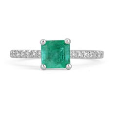 Elegantly displayed is a natural Asscher-cut emerald and diamond ring. The center gem is a beautiful quality, Asscher cut, emerald filled with life and brilliance! Among the emeralds, impressive qualities are their vibrant color and beautiful eye clarity. Numerous brilliant-cut diamonds are firmly pave set on the straight shank. The ring is made in a solid 14K white gold, prong setting. This engagement ring is simply perfect! Setting Style: Prong/Pave Setting Material: 14K White Gold Setting Wei Emerald Ring With Center Stone In 14k White Gold, Fine Jewelry Emerald Ring With Princess Cut, White Gold Emerald Rings With Pave Setting, Princess Cut Emerald Ring With Center Stone, Emerald Cut Green Jewelry With Pave Setting, Green Diamond Rings With Pave Setting, Green Emerald Center Stone Ring In 14k White Gold, Diamond Emerald Ring With Pave Setting, White Gold Emerald Ring With Pave Setting As Gift