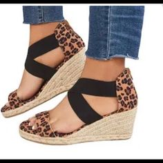 Leopard Print. Black Stretch Bands Cross Over Top Of Foot. Zipper Back. Espadrilles. Wedge. Size 8. Never Worn. New. Cute With Your Fav Jeans. Black Casual Wedge Sandals With Round Toe, Casual Black Wedge Sandals With Round Toe, Black Round Toe Wedge Sandals, Black Round Toe Casual Wedge Sandals, Casual Brown Wedge Sandals With Round Toe, Black Wedge Sandals With Round Toe For Vacation, Casual Espadrille High Heel Wedge Sandals, Black Espadrilles For Summer Vacation, Black Summer Espadrilles For Vacation