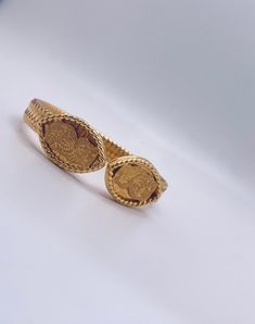 This Traditionally hand-crafted cuff bracelet in lustrous gold purity stands testament to its impeccable quality and artistry. a timeless piece of treasure in 37.20 grams of 21k gold Luxury Gold Cuff Bracelet For Ceremonial Use, Luxury Gold Cuff Bracelet For Ceremonial Occasions, Gold Bangle With Oyster Bracelet For Anniversary, Hallmarked Yellow Gold Cuff Bangle, Formal 22k Yellow Gold Cuff Bracelet, Luxury 22k Gold Bracelet For Formal Occasions, Traditional 14k Yellow Gold Bangle, Ceremonial Yellow Gold Hallmarked Cuff Bracelet, Anniversary Yellow Gold Cuff Bracelet With Oyster Design