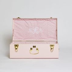 a pink suitcase with the word mr and mrs printed on it's lid, sitting in front of a white background