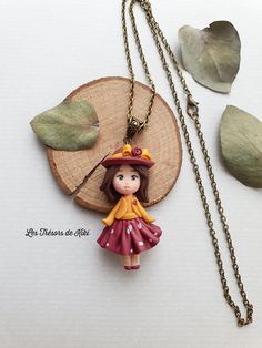 Fancy necklace - handmade jewelry. Doll necklace - children's jewelry Small figurine made with care, by hand, without mold. The doll is mounted on a bronze-colored chain with a lobster clasp. Doll: 5.5 cm Length of the chain: 56 cm Customizable: if you want another chain size, please let me know in the comments when ordering. Delivery: letter followed Sent in a pretty gift box in bubble wrap. This piece of jewelry is not a toy, it is not recommended for children under eight years old. ---------- Red Polymer Clay Necklace For Gift, Handmade Red Necklaces For Birthday, Handmade Red Necklace For Birthday, Handmade Polymer Clay Whimsical Necklaces, Whimsical Handmade Polymer Clay Necklaces, Handmade Whimsical Necklace For Birthday, Whimsical Handmade Necklaces For Birthday, Cute Pink Polymer Clay Necklace, Whimsical Handmade Necklaces For Birthdays