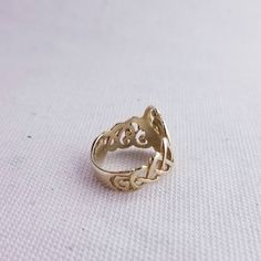 This vintage 10K gold Children of Lir ring is made by TJH of Ireland. The swan motif represents the transformation of the Children of Lir into swans. Size 5 1/4 Stamps: 10K Total Weight: 3.5g Width: 18mm face to 6mm band These pieces are pre-owned vintage jewelry. As this jewelry is not new there may be signs of wear or age. Each piece is sold as-is unless otherwise specified (ex. sizing). We strive to only sell vintage jewelry that is in good wearable condition. As with any jewelry, care and pr Art Nouveau 14k Gold Jewelry With Intricate Design, 14k Gold Art Nouveau Ring Jewelry, Art Nouveau 14k Gold Jewelry For Anniversary, Art Nouveau Yellow Gold Jewelry For Anniversary, Yellow Gold Art Nouveau Jewelry For Anniversary, Art Nouveau 14k Gold Wedding Jewelry, 14k Gold Art Nouveau Jewelry For Anniversary, Gold Art Nouveau Jewelry For Anniversary, Art Nouveau Gold Jewelry For Anniversary