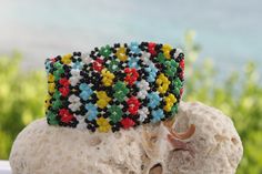 Traditional Romanian artisanal design - multicolor bracelet, made out of seedbeads and strung on stretchable elastic. Comes in a gift box. For a matching necklace please click here  https://www.etsy.com/listing/1099426314/traditional-romanian-multicolor-necklace?ref=listings_manager_grid Multicolor Necklace, Multicolor Bracelet, Artisanal Design, Artisan Bracelets, Matching Necklaces, Star Patterns, Country Style, Fashion Bracelets, Seed Beads