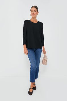 Simple, chic, and classic, the Black Bedford Top is the wardrobe essential that’ll give your closet the refresh it needs. With slightly structured shoulders and a high to low hem, this sophisticated number can be tucked in or out depending on your look. Pair with trousers and flats for an elevated office look or opt for denim and platform heels for an effortless party outfit that’ll have you ready in 5 minutes flat! Scoop neckline Structured shoulders Bracelet length sleeves Relaxed fit Material Chic Stretch Blouse For Business Casual, Sleek Relaxed Fit Blouse For Work, Chic Stretch Blouse For Work, Chic Black Tops With Structured Shoulders, Chic Tailored Blouse For Spring, Structured Classic Tops For Spring, Chic Relaxed Fit Formal Tops, Chic Formal Tops With Relaxed Fit, Chic Tailored Fall Blouse