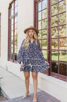 Floral Bohemian Dreamer! The Alana Dress has us all in our feelings. The Tiered Mini Dress features long balloon sleeves, tassel ties and a pretty floral print. Style the babydoll mini dress with heels for a day out with your girls or with sneakers for a more casual look. Black and white Floral print Split neckline Knee Length Tassel ties Tiered ruffle babydoll silhouette Contrast white piping trim Balloon peasant sleeves with elastic cuffs Smocked shoulder detail Relaxed Fit (Loose Fit) 100% Po Spring Day Out Dress With Tassels, Spring Boho Dress With Tassels, Spring Tassel Mini Dress, Spring Long Sleeve Dresses With Tassel Ties, Spring Mini Dress With Tassels, Spring Mini Dress With Balloon Sleeves, Flowy Spring Dress With Tassels, Mini Dress With Heels, Babydoll Mini Dress