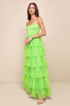 Treat any event like your own personal fashion show when you're wearing a show-stopping look like the Lulus Rule the Runway Lime Green Tulle Bustier Tiered Maxi Dress! This stunning dress is composed of sheer mesh tulle (atop a stretch knit lining) that shapes an alluring bustier-inspired bodice with seamed cups and supportive boning, a sweetheart neckline, and adjustable spaghetti straps. The high, fitted waist tops an A-line maxi skirt, adorned with fluffy tiers of tulle that are sure to make Green Evening Dress With Corset Back For Gala, Green Tulle Dress For Gala, Glamorous Overbust Prom Dress, Green Evening Dress With Corset Back, Elegant Green Corset Dress For Evening, Glamorous Overbust Dress For Cocktail, Overbust Evening Dress For Prom Season, Green Tulle Evening Dress For Gala, Glamorous Overbust Dresses For Gala