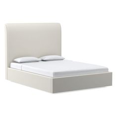 a white bed with two pillows on top of the headboard and one foot board