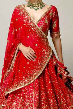 Red raw silk lehenga with attached cancan and embroidery in a checkered pattern in sequins, zardozi and micro crystals. Paired with an embroidered padded blouse and a splatter embroidered dupatta.
Component: 3
Pattern: Embroidery
Type Of Work: Sequins, Zardozi, Micro Crystals
Neckline: V Neck
Sleeve Type: Half sleeves
Fabric: Lehenga and Blouse: Raw Silk, Dupatta: Georgette
Color: Red
Other Details: 
Attached Lining
Sequins,micro crystals,zardozi work
Occasion: Bride,Wedding - Aza Fashions Red Raw Silk Pre-draped Saree For Traditional Ceremonies, Reception Raw Silk Dupatta With Tilla Detail, Red Chanderi Lehenga For Wedding, Traditional Red Pre-draped Saree For Weddings, Red Chanderi Lehenga With Traditional Drape, Red Anarkali Set With Gota Work For Traditional Ceremonies, Red Art Silk Lehenga With Gota Work, Red Bollywood Choli With Gota Work, Red Pre-draped Saree With Resham Embroidery For Traditional Ceremonies