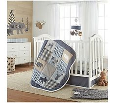 a baby's room with a crib, dresser and teddy bear bedding