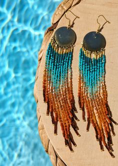 ♀️ Handmade seed bead earrings created with glass beads, brass, and sterling silver ear wires. ♀️ Beads: Czech, Toho ♀️ Ear Wire: Sterling silver ♀️ Drop Height: 6 in. ♀️ Thread: Nylon ♀️ Nickel free ♀️ Care instructions: To maintain earrings's brightness, please do not shower, swim, or workout with them Artisan Multicolor Beaded Earrings With Gold Beads, Gold Heishi Bead Earrings With Colorful Beads, Gold Heishi Beaded Earrings With Colorful Beads, Gold Heishi Beads Earrings, Gold Dangling Heishi Beads Earrings, Summer Gold Beaded Dangle Earrings, Beach Heishi Beaded Earrings, Artisan Beaded Heishi Beads Earrings, Artisan Beaded Earrings With Heishi Beads