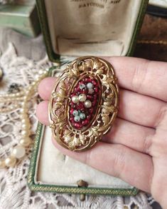 "Beautiful French Antique c1910s Art Nouveau Leaf-shape Ornamental Gold Tone Metal with Faux Pearls and Glass Garnet Beads Big Oval Brooch, Gift for Woman Size - approx. 38x52,5mm / 1,52\" x 2,06\" Brooch is in a good antique condition, big and beautiful, with decorative leaf-shape ornamental gold tone metal base, with round glass garnet beads and little faux pearls attached to it.  Little pearls has visible signs of age, pearl coating mostly chipped off, but it only shows that unique signs of age and overall it still looks so beautiful!  Brooch has this \"taken from grandma's jewelry box\" look - old and fascinating.  Rare unique piece! ✨  Perfect as a gift for antique and vintage loving woman! 🧡  Found somewhere in France  :) __ Maybe you are looking for something specific from France? Red Victorian Jewelry For Ceremonial Occasions, Antique Baroque Brooches For Wedding, Antique Wedding Brooch With Intricate Design, Victorian Wedding Brooches With Intricate Design, Heirloom Oval Brooches For Wedding, Antique Red Brooch As Gift, Antique Red Brooches As A Gift, Antique Red Brooches As Gift, Antique Red Brooches For Gift