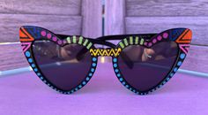 Heart cat eye frames with a funky rainbow design. Fun Multicolor Sunglasses For Festivals, Fun Multicolor Festival Sunglasses, Multicolor Tinted Sunglasses For Festivals, Multicolor Tinted Festival Sunglasses, Trendy Multicolor Heart-shaped Sunglasses, Multicolor Heart-shaped Sunglasses With Gradient Lenses, Heart-shaped Multicolor Sunglasses With Gradient Lenses, Fun Cat Eye Sunglasses With Gradient Lenses, Brevard Nc