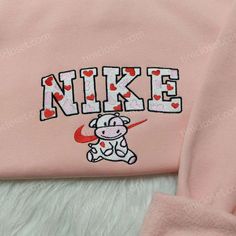 Introducing the Nike Cow Heart Love Embroidered Sweatshirt, the perfect blend of style and love for your wardrobe! Made with premium quality fabric, this sweatshirt features a beautiful animal embroidered hoodie design, making it one of the best Valentine’s Day gifts. The unique cow heart embroidery adds a touch of charm and warmth to your outfit, making you stand out from the crowd. With its comfortable fit and cozy feel, this sweatshirt offers both style and comfort. Whether you’re Cow Heart, Sailor Moon Shirt, Animal Hoodie, Animal Embroidery Designs, Best Valentine's Day Gifts, Heart Embroidery, Embroidery Sweatshirt, Nike Sweatshirts, Embroidered Sweatshirt