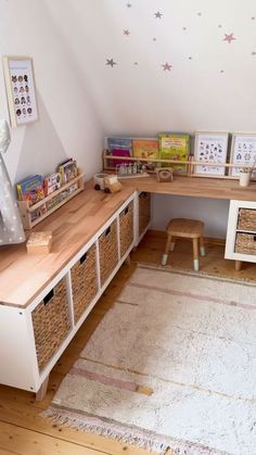 a child's playroom with toys and books on the shelves, along with toy storage bins