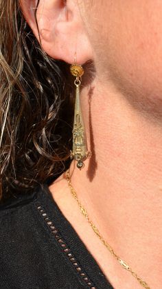 A lovely lengthy pair of Georgian era earrings. These earring are crafted from 14K Yellow gold. The tops appear to have been conversion to hooks, most likely they were day and night earrings. The decoration at the front is original the hooks appear to have been replaced. The tops feature a flower with a textured background. They suspend the long drop The drops are decorated with lovely appliqués in 14K yellow gold with a textured background. They match the tops. These earrings are in good condit Victorian Yellow Gold Dangle Earrings, Ceremonial Drop Earrings, Heirloom Pierced Drop Earrings, Heirloom Drop Earrings, Pierced, Heirloom Drop Earrings, Antique 14k Gold Dangle Earrings, Victorian 14k Gold Drop Earrings, Heirloom Style Gold Drop Earrings, Heirloom Gold Drop Earrings