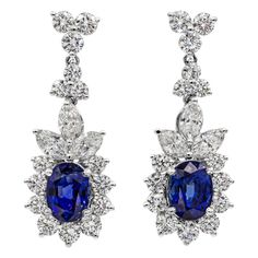 These beautiful earrings feature two natural blue sapphires weighing 3.72 carats total. These sapphires have a royal blue color and are eye clean. These sapphires are accented with 3.23 carats of brilliant diamonds. Set in 18k white gold. Has post. A timeless piece. Elegant Dressing, Blue Sapphire Necklace, Diamond Dangle Earrings, Blue Sapphire Diamond, Royal Jewels, Sapphire Pendant, Expensive Jewelry, Sapphire Necklace, Natural Blue Sapphire