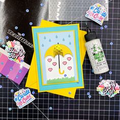 an assortment of crafting supplies are laid out on a table with confetti and stickers