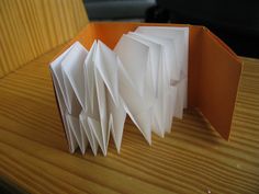 an open book sitting on top of a wooden table