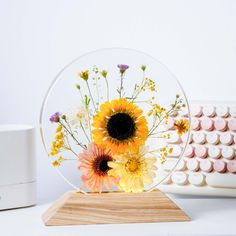 a vase filled with flowers sitting on top of a table