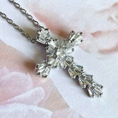 Brilliant Silver Tone Cross  Pendant Necklace  Sparkling White Jewel and Rhinestone Jeweled Cross  Silver Plated 18 Inch Chain  Lobster Clasp Closure Christian or Catholic Cross Comes in Gift Box and Organza Gift Bag Ships within 3 days. Will ship first class mail.  See our shop Hello Emiko for more beautiful handmade jewelry and gifts. Elegant Rhinestone Cross Necklace On Clavicle Chain, Elegant Rhinestone Cross Clavicle Necklace, Elegant Cross Rhinestone Necklace For Parties, Elegant Cross-shaped Rhinestone Necklace For Parties, Crystal Cross Necklace With Adjustable Chain, Elegant Rhinestone Cross Pendant Clavicle Necklace, Crystal Rhinestone Cross Necklace As Gift, Crystal Cross Pendant Jewelry With Rhinestones, Crystal Cross Jewelry With Adjustable Chain