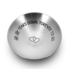 a metal bowl with the words years down, forever to go written on it