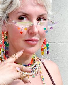 The perfect party glasses for any occasion! Material: 18K Gold Plated Brass; Cubic Zirconia; Transparent Neon Pink, Rust, Yellow, Green, Blue, Purple, & Iridescent Acrylic Handmade in NYC, ready to ship! Not UV protected. Do not wear while driving! We are a small team: processing takes between 1-10 business days, depending on the number of orders. Thank you for your patience! Shipping and Returns policy All sales items are final sale Have questions/need help? We're here for you! help@islynyc.com or reach out in our chat box!#ISLYNYC @ISLYNYC #ISLYicon Fun Plastic Jewelry For Party, Fun Plastic Party Jewelry, Handmade Clear Jewelry For Party, Rainbow Plastic Party Jewelry, Multicolor Plastic Jewelry For Party, Plastic Beaded Jewelry For Party, White Glass Jewelry For Party, Summer Party Glass Jewelry, Clear Glass Jewelry For Party