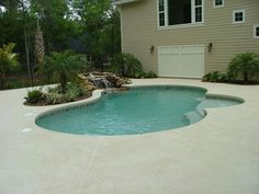 a small pool in front of a house