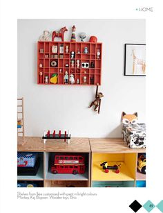 children's playroom with toy shelves and toys on the wall, including a firetruck